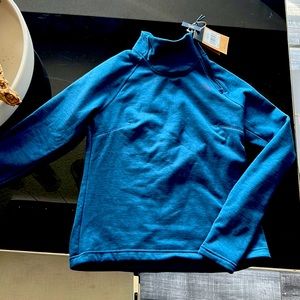 North face blue sweatshirt. New with tags. High neck side zip.